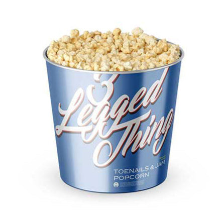 Popcorn in a blue container with 'Lighted Thing' branding on a white background