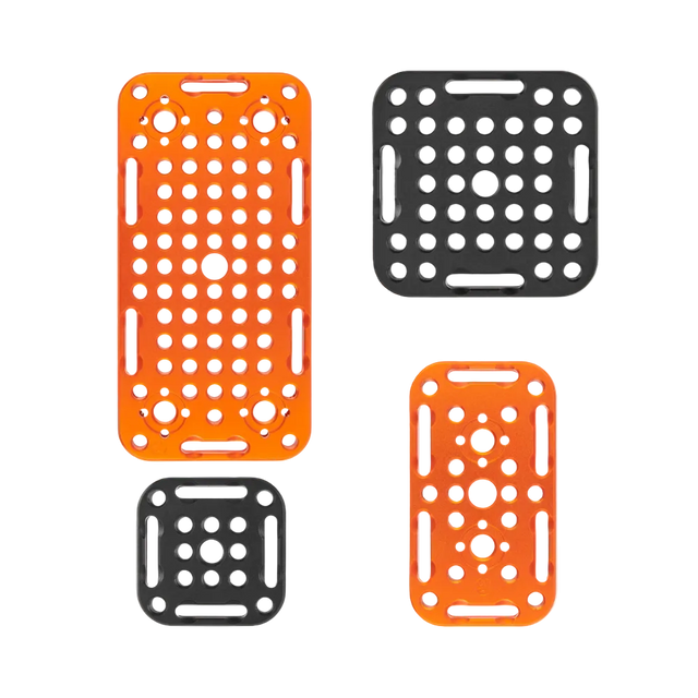 Four plastic mesh racks in orange and black on a white background