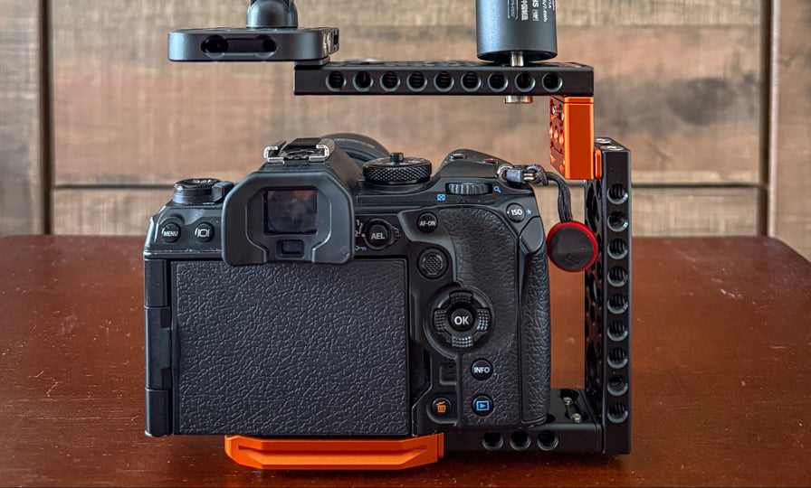 Camera setup with a microphone and camera on a wooden surface